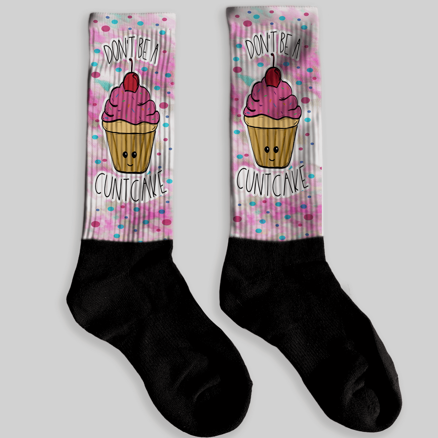 Socks with a cupcake design and text on a light gray background