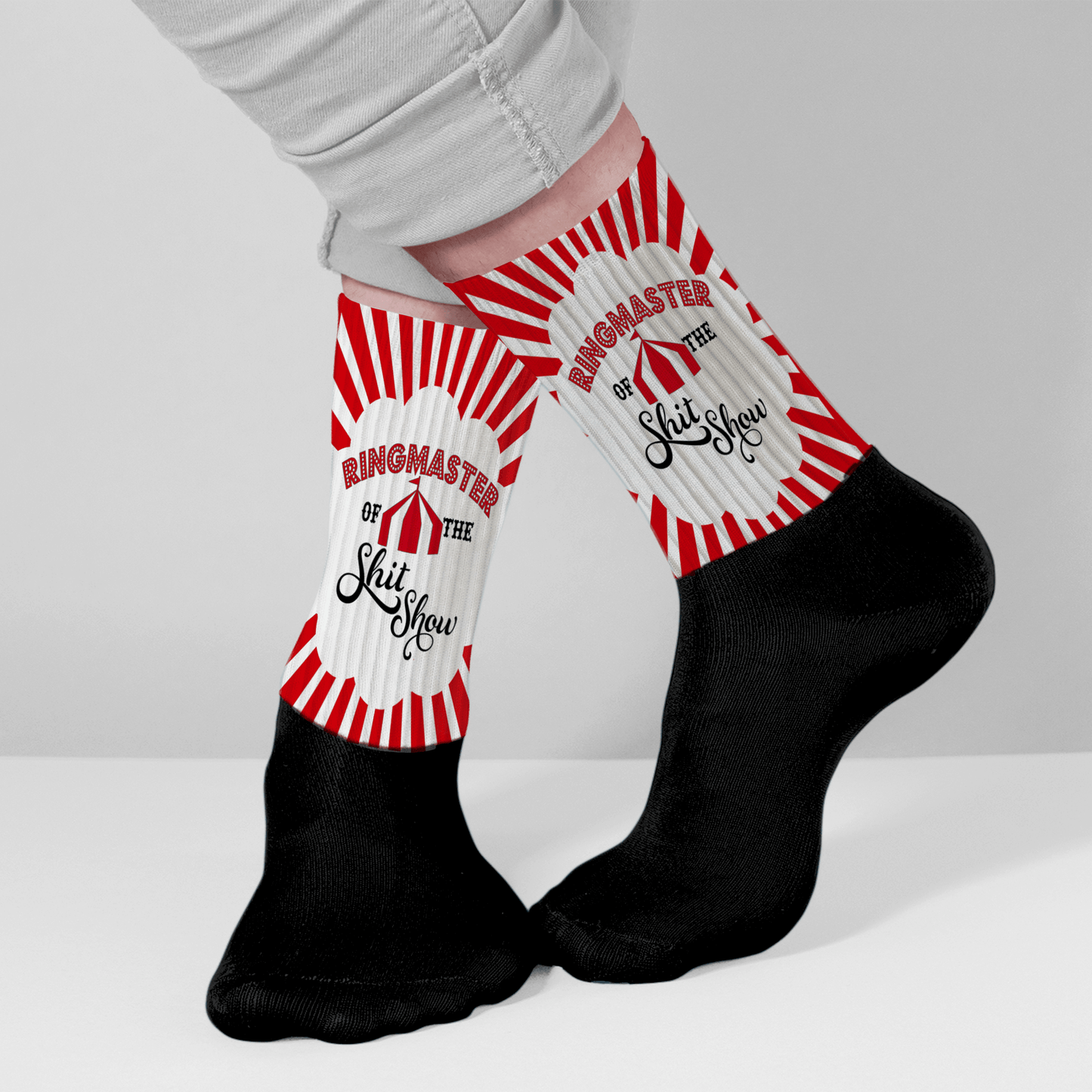 Model wearing crew socks with a circus design