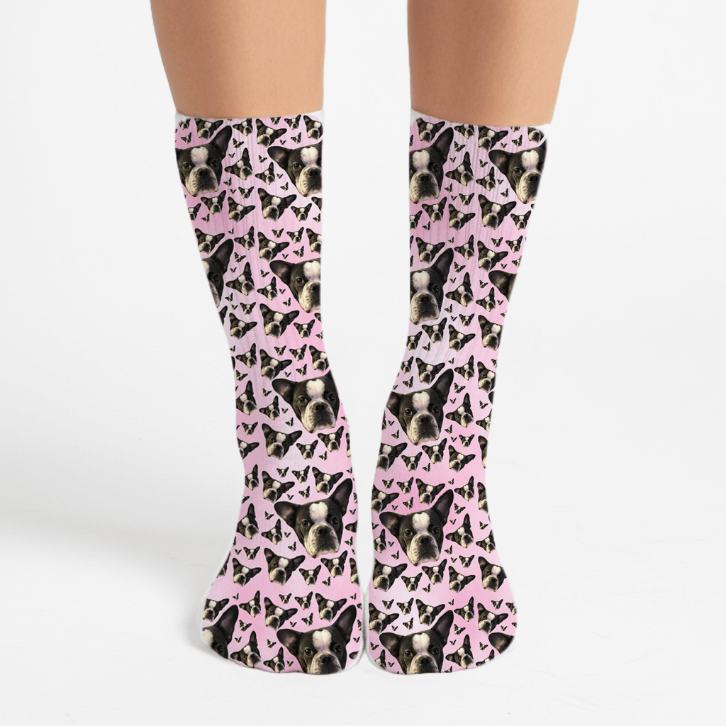 Socks with a pattern of dogs and pink bows on a white background