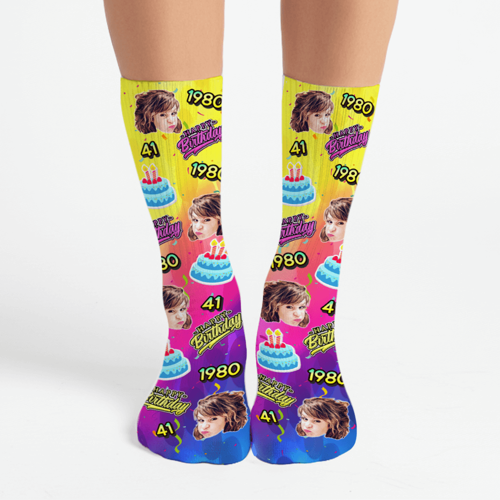 Colorful socks with birthday design and year on a white background