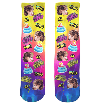 Two colorful socks with a birthday design and text on a white background