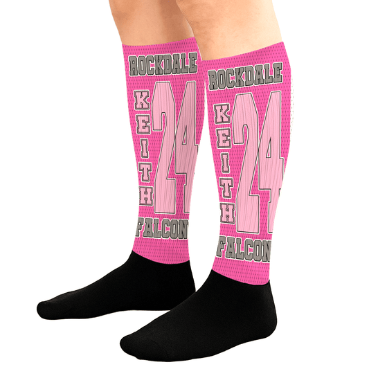 Pink cancer support knee-high socks with personalized player name, number, team, and ribbon pattern.