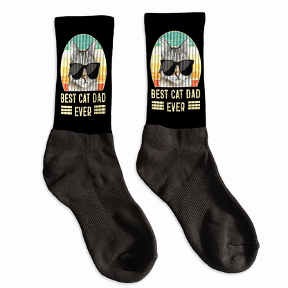 Black socks with a cat graphic and 'Best Cat Dad Ever' text 