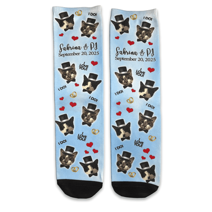 Personalized socks with cat photos and text on a light blue background