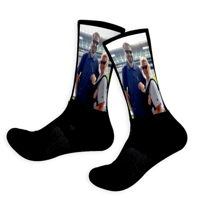 Black socks with a printed selfie design on a white background