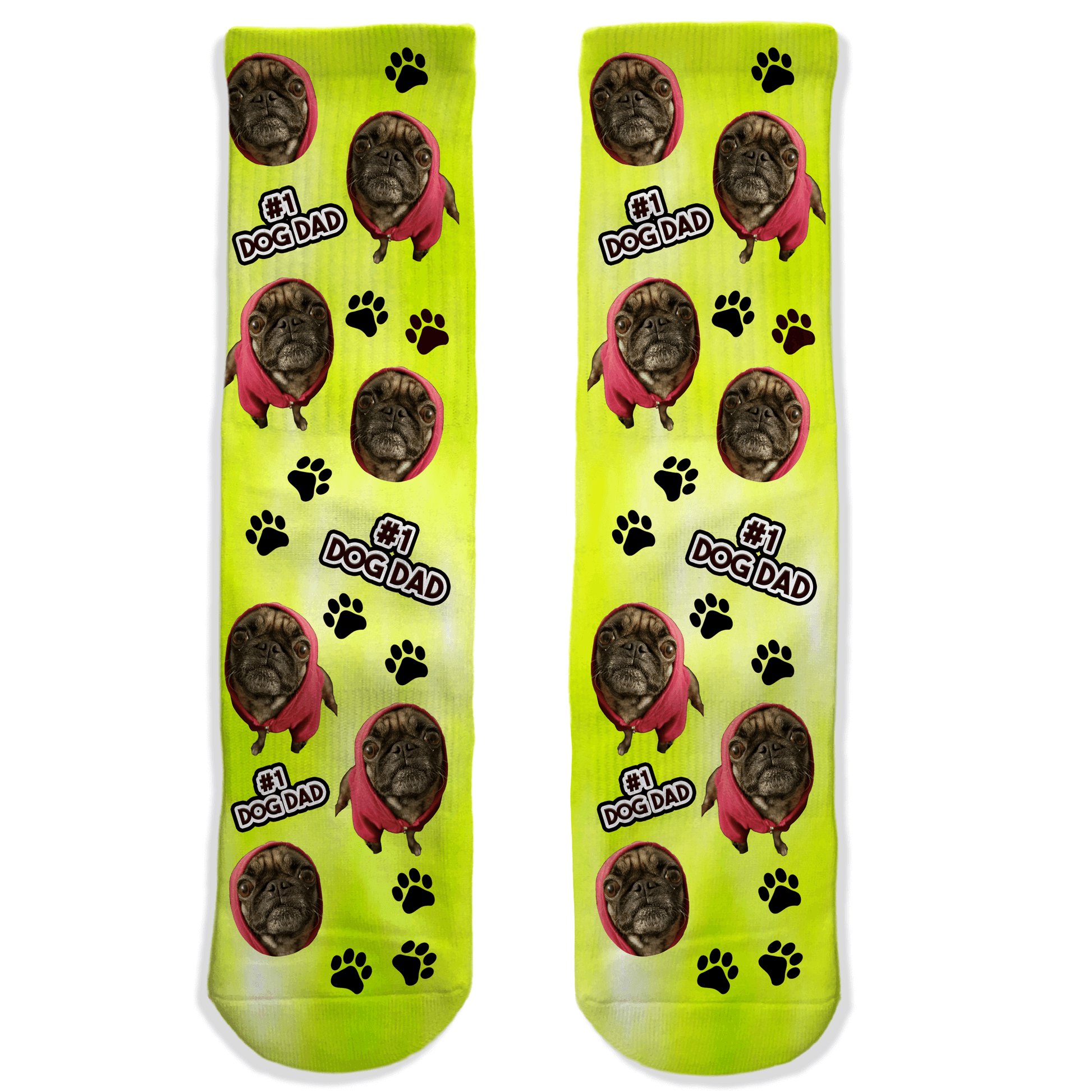 Two yellow socks with a dog's face and '1 Dog Dad' text on a white background