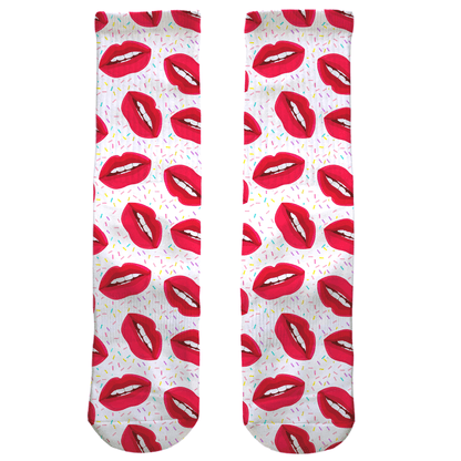 Pair of socks with red lip pattern on a white background