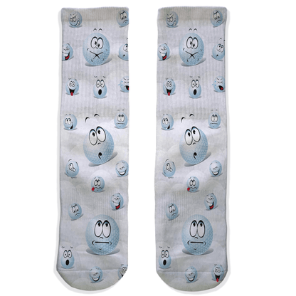 Two socks with golf balls cartoon character faces on a white background