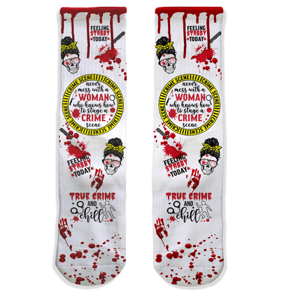 Pair of socks with a graphic design featuring text and a woman's face, on a white background.