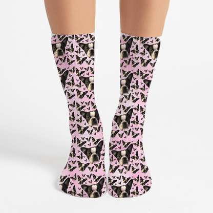 Socks with a pattern of dogs and pink bows on a white background
