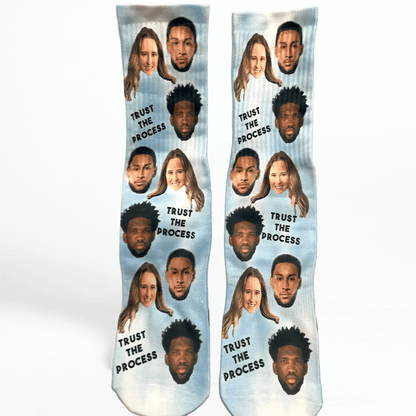 Socks with faces of people and custom message text on a white background