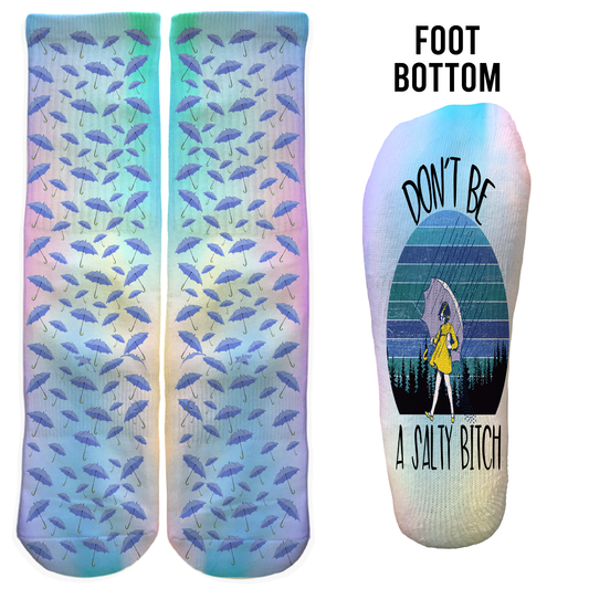 Funny pastel umbrella crew socks with “Don’t Be a Salty Bitch” on the foot. Sassy gift for friends or everyday wear.