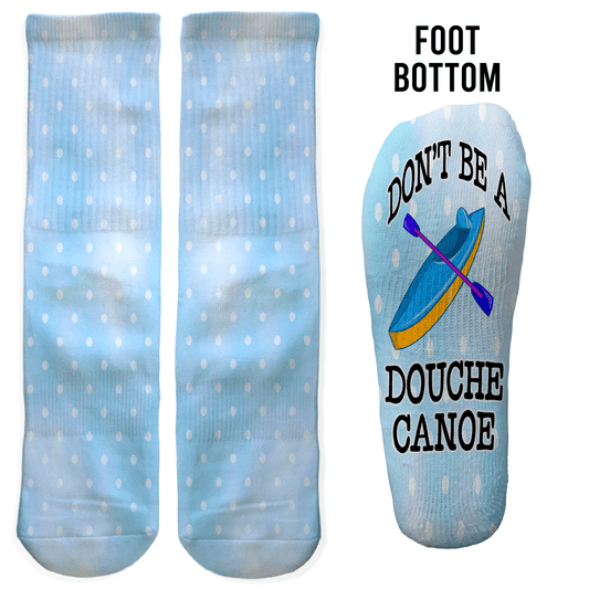 Blue polka dot crew socks with “Don’t Be a Douche Canoe” and canoe graphic on the foot. Funny adult gift for Secret Santa or white elephant.