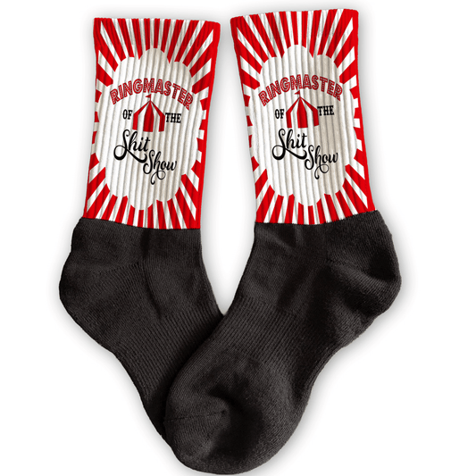Funny circus crew socks with “Ringmaster of the ShitShow” design, red and white stripes, adult novelty gift.